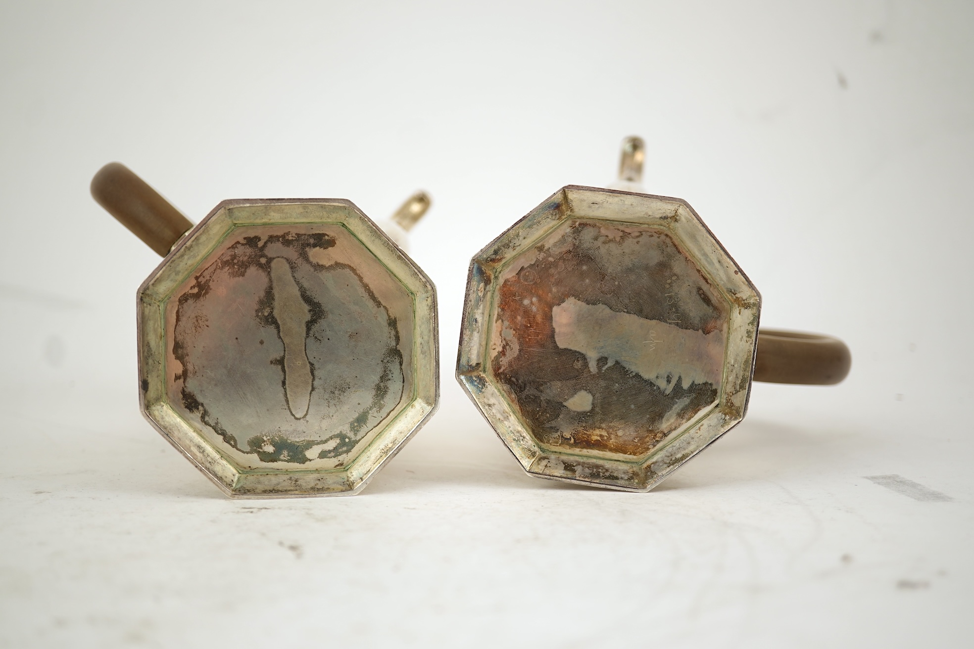 A pair of George V octagonal silver café au lait pots, by William Comyns & Sons Ltd